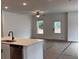 Open-concept living area with ample natural light and a view into the kitchen at 3230 Cyrus Creek Dr, Kennesaw, GA 30152