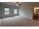 Bright main bedroom with two windows and ensuite bathroom at 3230 Cyrus Creek Dr, Kennesaw, GA 30152