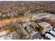 Aerial view of townhome community with swimming pool, surrounding neighborhood, and city skyline at 380 Grant Se Cir # 110, Atlanta, GA 30315
