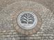 Beautiful decorative circular sign in Grant Park with the name and logo on the ground at 380 Grant Se Cir # 110, Atlanta, GA 30315
