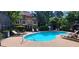 Enjoy the community pool with lounge chairs and tables for relaxing outdoors at 380 Grant Se Cir # 110, Atlanta, GA 30315