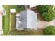 Aerial view of the home, showing the roof, driveway, and fenced backyard with a trampoline and lush lawn at 4945 Racquet Ct, Duluth, GA 30096