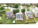 Aerial view of a home with a fenced backyard, patio, and view of the neighborhood pond at 4945 Racquet Ct, Duluth, GA 30096