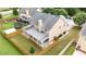 Aerial view of the home showcasing a well-manicured lawn and fenced backyard with a covered patio at 4945 Racquet Ct, Duluth, GA 30096