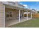 Covered back patio features ceiling fans, lighting, and outdoor space at 4945 Racquet Ct, Duluth, GA 30096