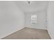 Well-lit bedroom features neutral carpet, white walls, and a bright window at 4945 Racquet Ct, Duluth, GA 30096