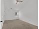 Bright bedroom features neutral carpeting, ceiling fan, and natural light through a window at 4945 Racquet Ct, Duluth, GA 30096