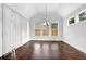 Dining room with tall windows that overlook the backyard with a vaulted ceiling at 4945 Racquet Ct, Duluth, GA 30096