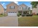 Charming two-story brick home with a well-maintained lawn and attached two car garage at 4945 Racquet Ct, Duluth, GA 30096