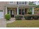 Inviting front porch with white columns and manicured shrubbery creating a welcoming entrance at 4945 Racquet Ct, Duluth, GA 30096