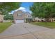 Charming two-story brick home with a well-maintained lawn and attached two car garage at 4945 Racquet Ct, Duluth, GA 30096