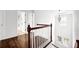 Stairway featuring wood railing and floors at 4945 Racquet Ct, Duluth, GA 30096