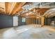 Exposed basement with wooden framing, and an unfinished concrete floor at 1377 Hill Sw Dr, Conyers, GA 30094