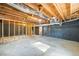 Exposed basement with wooden framing, and an unfinished concrete floor at 1377 Hill Sw Dr, Conyers, GA 30094