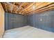 Unfinished basement with concrete walls and an exposed beam ceiling at 1377 Hill Sw Dr, Conyers, GA 30094
