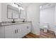 Bathroom featuring double vanity, granite countertops, and modern fixtures at 1377 Hill Sw Dr, Conyers, GA 30094