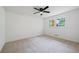 Carpeted bedroom with natural lighting, a ceiling fan, and modern trim at 1377 Hill Sw Dr, Conyers, GA 30094