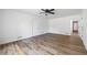 Bedroom with a ceiling fan, closet, and neutral color scheme at 1377 Hill Sw Dr, Conyers, GA 30094