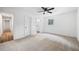 Bedroom featuring neutral walls, carpet, and ample closet space at 1377 Hill Sw Dr, Conyers, GA 30094