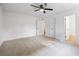 Spacious bedroom with neutral walls and a ceiling fan at 1377 Hill Sw Dr, Conyers, GA 30094