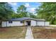 Charming single story home with a painted brick facade, and newly landscaped front yard at 1377 Hill Sw Dr, Conyers, GA 30094