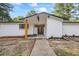 A front exterior featuring a white painted brick facade, and a newly landscaped front yard at 1377 Hill Sw Dr, Conyers, GA 30094