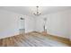 Open-concept living room with beautiful flooring and lots of natural light at 1377 Hill Sw Dr, Conyers, GA 30094