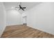 Spacious room with wood-look floors, a vaulted ceiling, and a modern ceiling fan at 1377 Hill Sw Dr, Conyers, GA 30094
