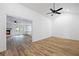 Spacious room featuring wood-look floors, and white walls throughout the property at 1377 Hill Sw Dr, Conyers, GA 30094