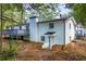 Back of house showing deck and large manicured lawn at 1377 Hill Sw Dr, Conyers, GA 30094