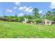 Picture of the side and backyard and the house and trees at 1574 Glenfield Dr, Lawrenceville, GA 30043