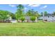 Expansive backyard featuring lush greenery and a charming single-story home with a well-maintained lawn at 1574 Glenfield Dr, Lawrenceville, GA 30043