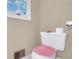 Toilet and toilet paper featuring beige walls with white trim at 1574 Glenfield Dr, Lawrenceville, GA 30043