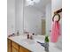 Bright bathroom featuring a white countertop, framed mirror and white fixtures at 1574 Glenfield Dr, Lawrenceville, GA 30043