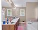 Bright bathroom with a double vanity and a separate tub at 1574 Glenfield Dr, Lawrenceville, GA 30043