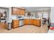 Bright kitchen featuring stainless steel appliances, oak cabinets and tile flooring at 1574 Glenfield Dr, Lawrenceville, GA 30043