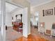 Open living space with hardwood floors transitioning to carpet, adjacent to a dining area at 1574 Glenfield Dr, Lawrenceville, GA 30043
