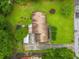 Aerial view of a home with a large yard, patio, and mature trees providing ample shade at 2095 Gherry Dr, Austell, GA 30106