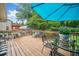 Outdoor deck with ample seating and an umbrella for shaded relaxation at 2095 Gherry Dr, Austell, GA 30106