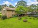 Spacious backyard featuring a deck, patio set, and a fire pit perfect for outdoor entertaining at 2095 Gherry Dr, Austell, GA 30106