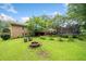 Relaxing backyard space with a fire pit, deck, and mature trees at 2095 Gherry Dr, Austell, GA 30106
