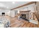 Basement featuring wood-look flooring and a cozy brick fireplace with an 'Amazing Grace' accent at 2095 Gherry Dr, Austell, GA 30106