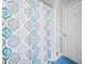 A bathroom featuring a shower with a blue patterned curtain at 2095 Gherry Dr, Austell, GA 30106