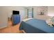 Comfortable bedroom featuring wood floors, a TV, and bright-colored decor at 2095 Gherry Dr, Austell, GA 30106