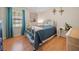 Comfortable bedroom featuring wood floors, natural light, and bright-colored decor at 2095 Gherry Dr, Austell, GA 30106