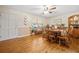 A dining room with wood flooring, wood table and chairs, window and decor at 2095 Gherry Dr, Austell, GA 30106