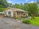 Charming single-story home with brick and siding, accented by a landscaped garden and paved driveway at 2095 Gherry Dr, Austell, GA 30106