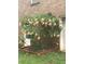 Trumpet tree with pink blooms outside brick house at 2095 Gherry Dr, Austell, GA 30106