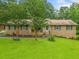 Charming single-story brick home with a well-manicured front yard and mature trees at 2095 Gherry Dr, Austell, GA 30106