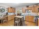 Warm, wooden kitchen with oak cabinets, updated countertops, and dining area, full of natural light at 2095 Gherry Dr, Austell, GA 30106